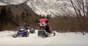 couples snowmobiling tour