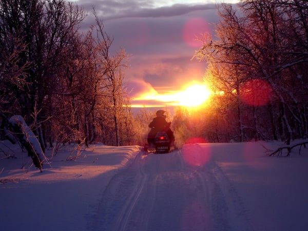 snowmobile into the mountains